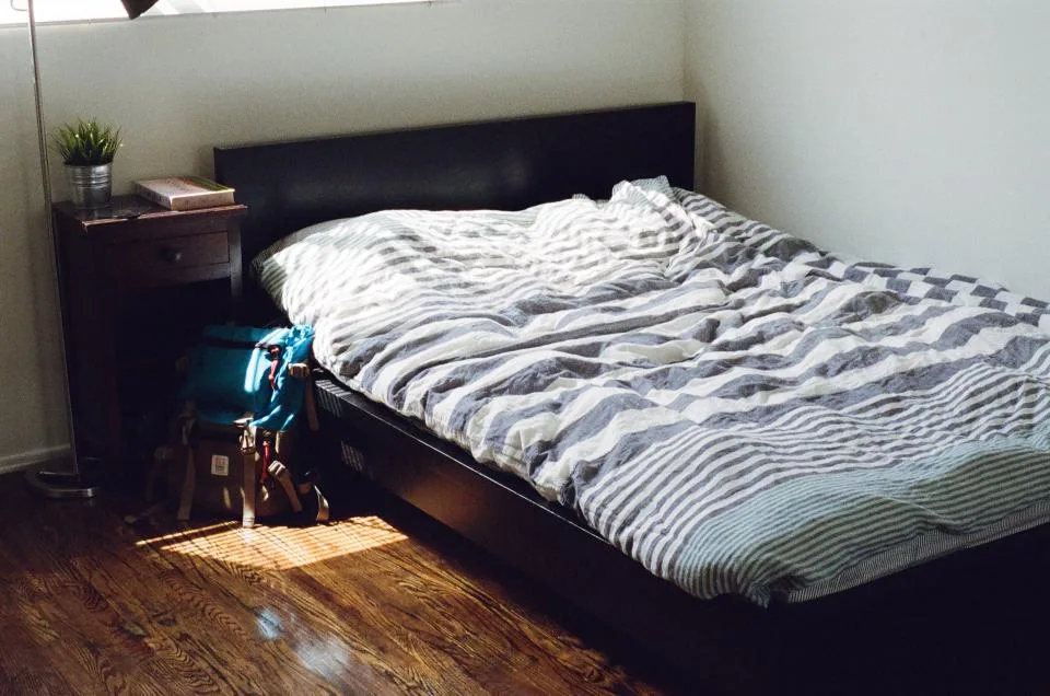 Editorial lifestyle photograph for how to choose bedding for different sleepers.